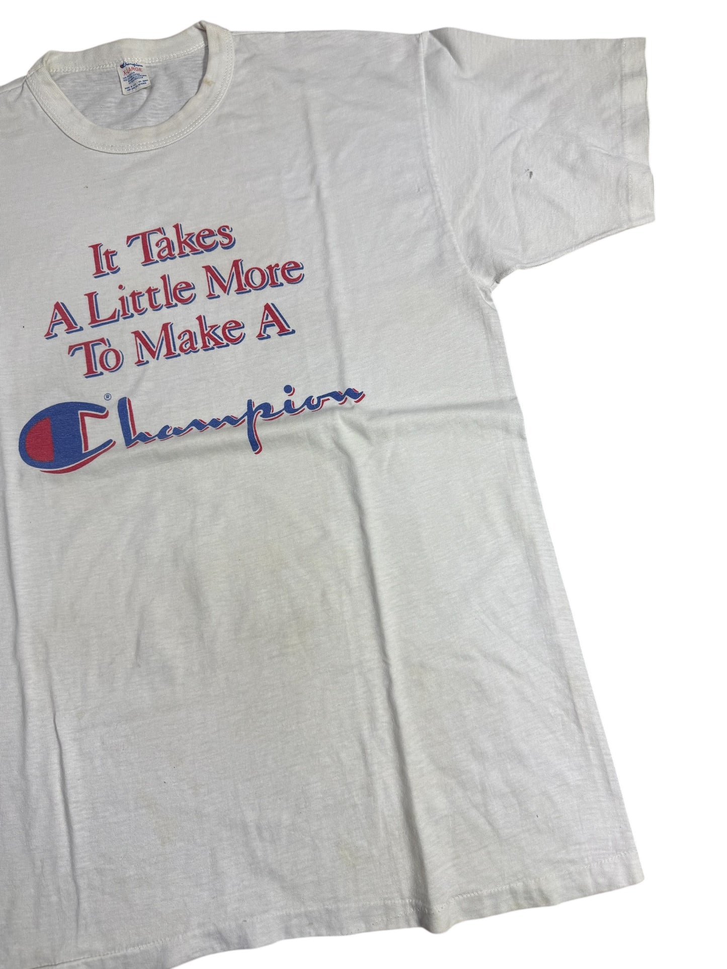 Vintage 1980s Champion Slogan Tshirt “It Takes A Little More To Make A Champion”